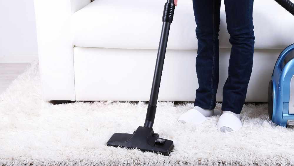 Use a vacuum to clean rugs