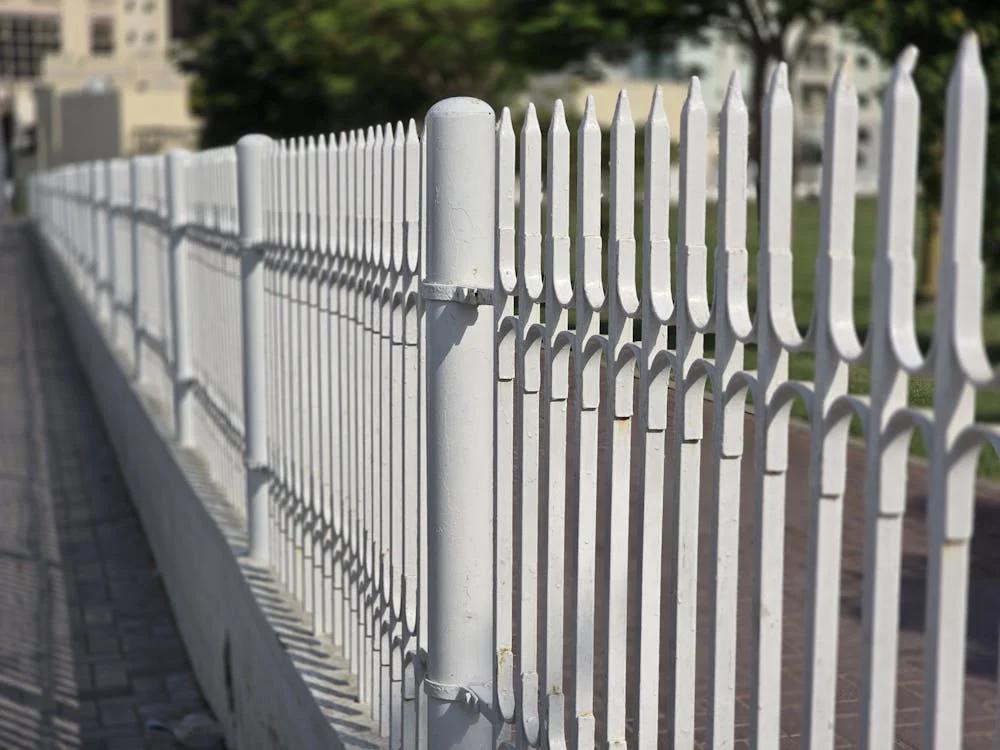 A white vinyl fence