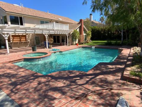 A pool with a raised spa